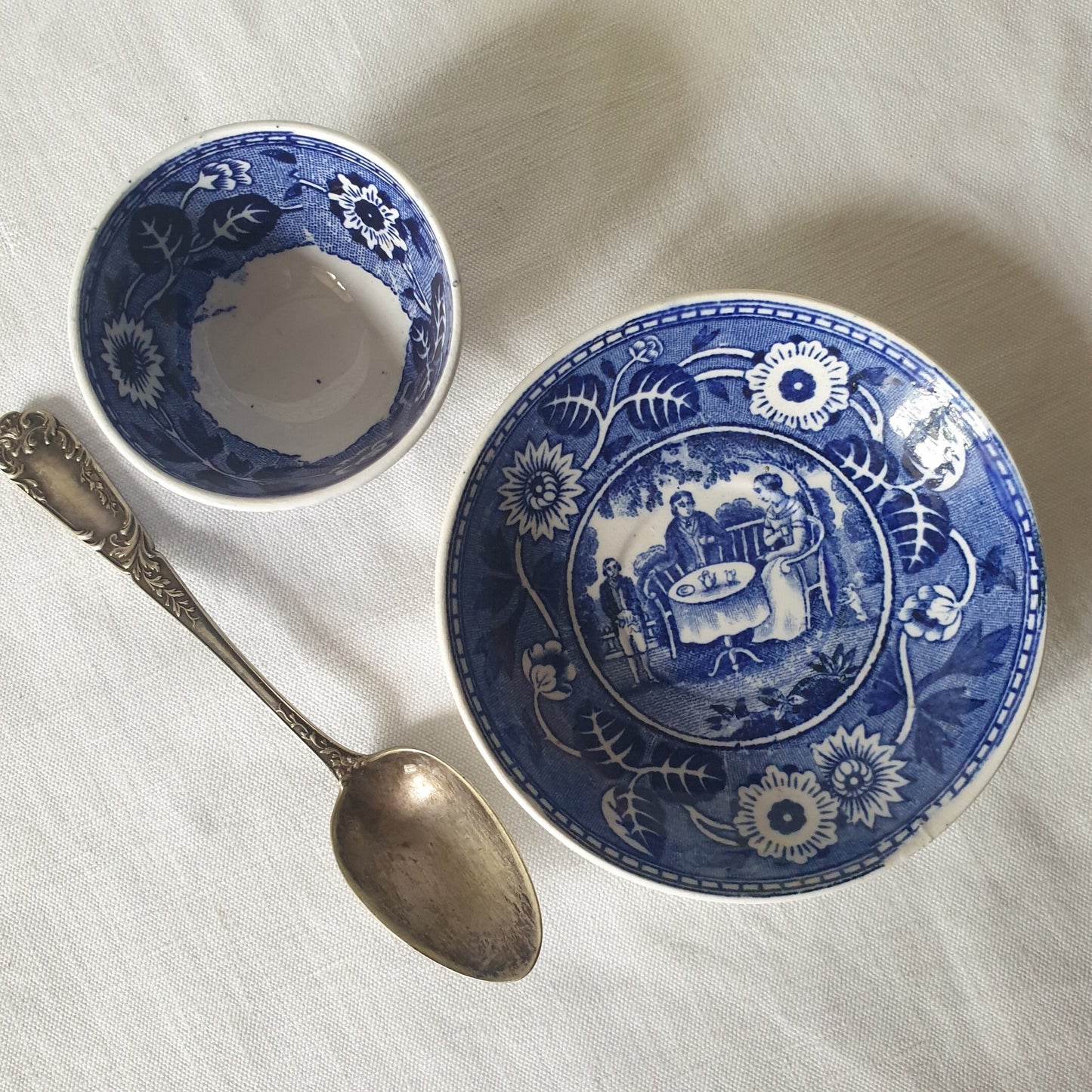 Children's small tea bowl & saucer, Victorian tea party scene, navy blue transferware, Societe Ceramique Maestricht, doll / child size set