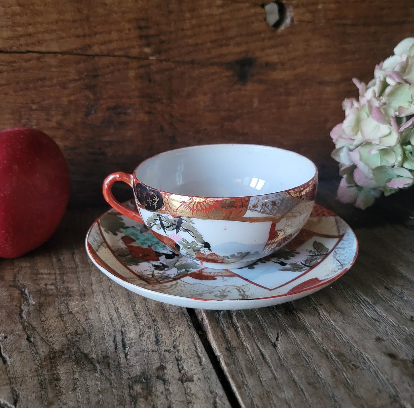 Antique Japanese Kutani eggshell porcelain teacup and saucer set, River's Edge pattern Geisha and water scenes, Meiji Era Japan c1900