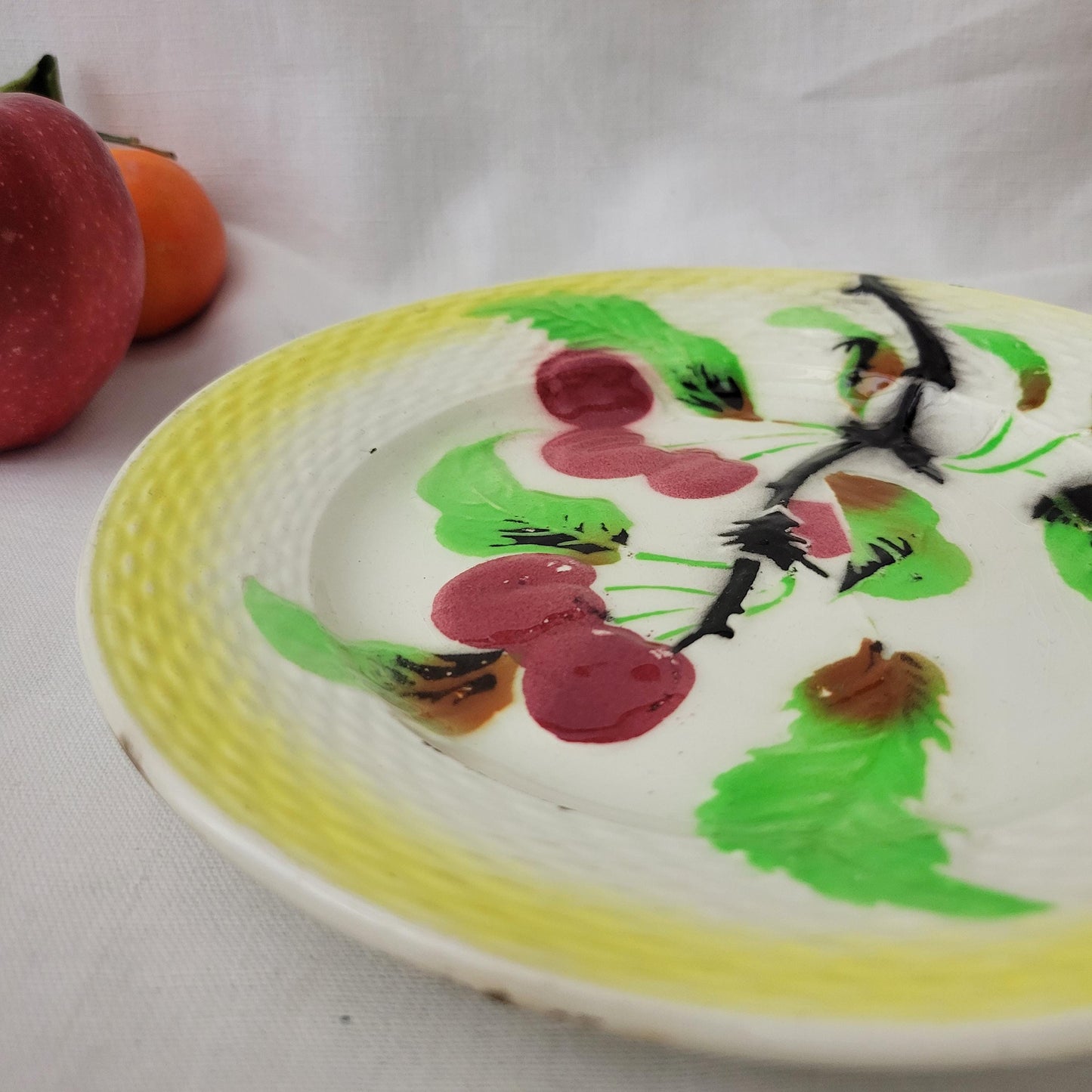 French antique barbotine majolica plate, cherry branch design, polychrome on yellow ground, basketweave border Moulin des Loups France c1900