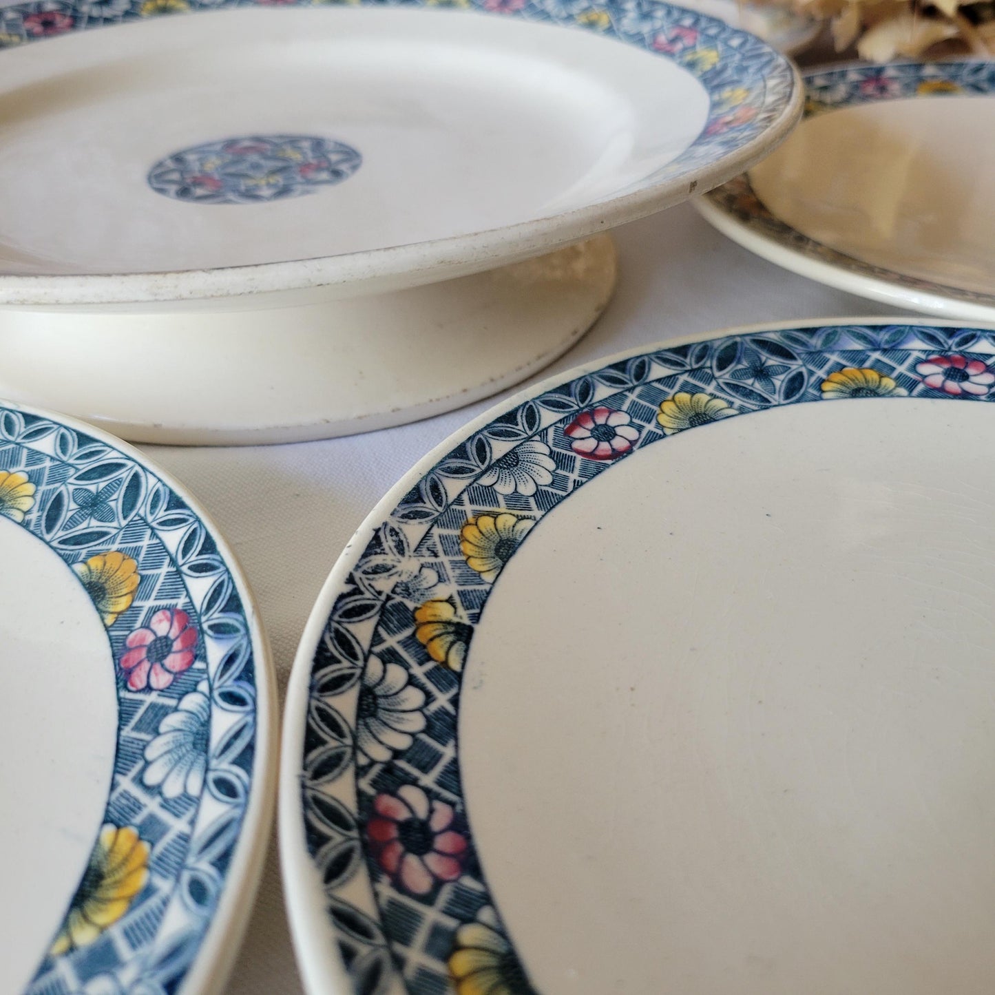 Antique French dessert service 6 plates + cake stand, blue transferware w pink / yellow florals, Art Deco faience, 'Manon' Longchamp, France