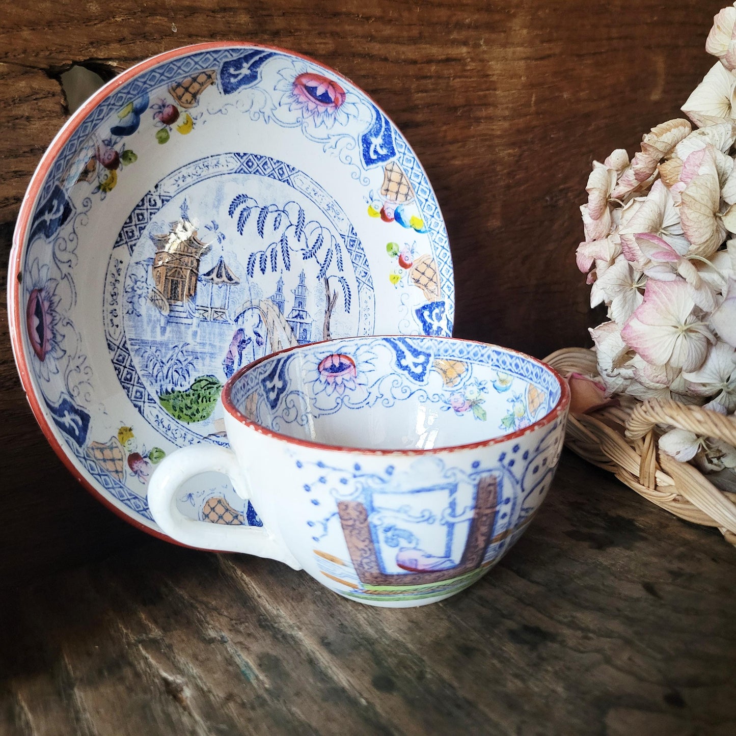 Sarreguemines tea / coffee / chocolate cup & saucer duo, French Chinoiserie style hand colored polychrome on blue transferware c1890 France
