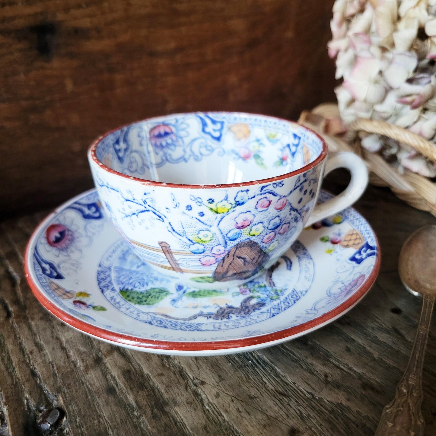 Sarreguemines tea / coffee / chocolate cup & saucer duo, French Chinoiserie style hand colored polychrome on blue transferware c1890 France