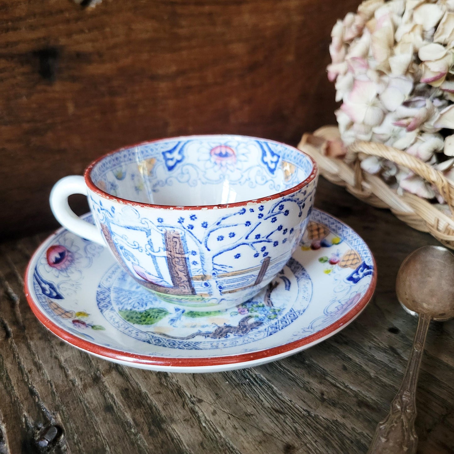 Sarreguemines tea / coffee / chocolate cup & saucer duo, French Chinoiserie style hand colored polychrome on blue transferware c1890 France