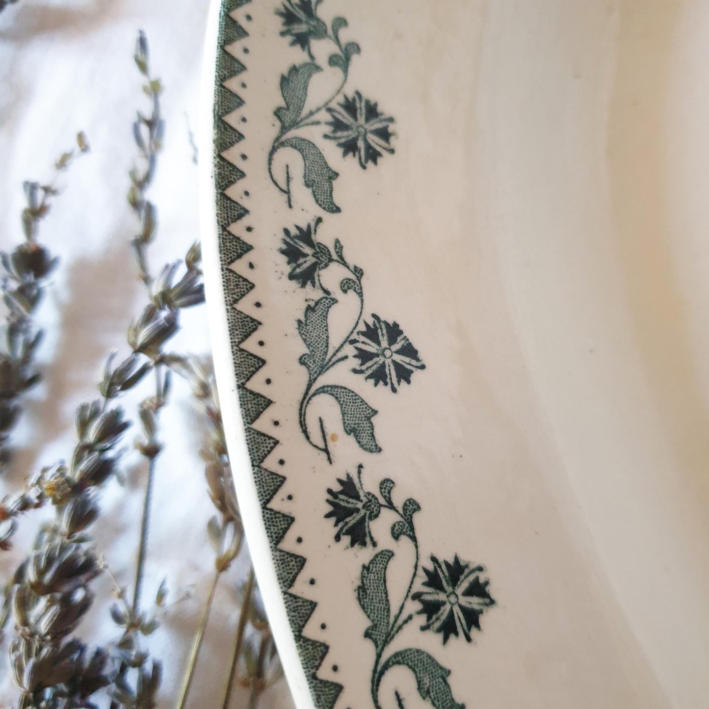 Border detail image of green transferware serving dish showing floral design, photo by Brocanteuse Vintage