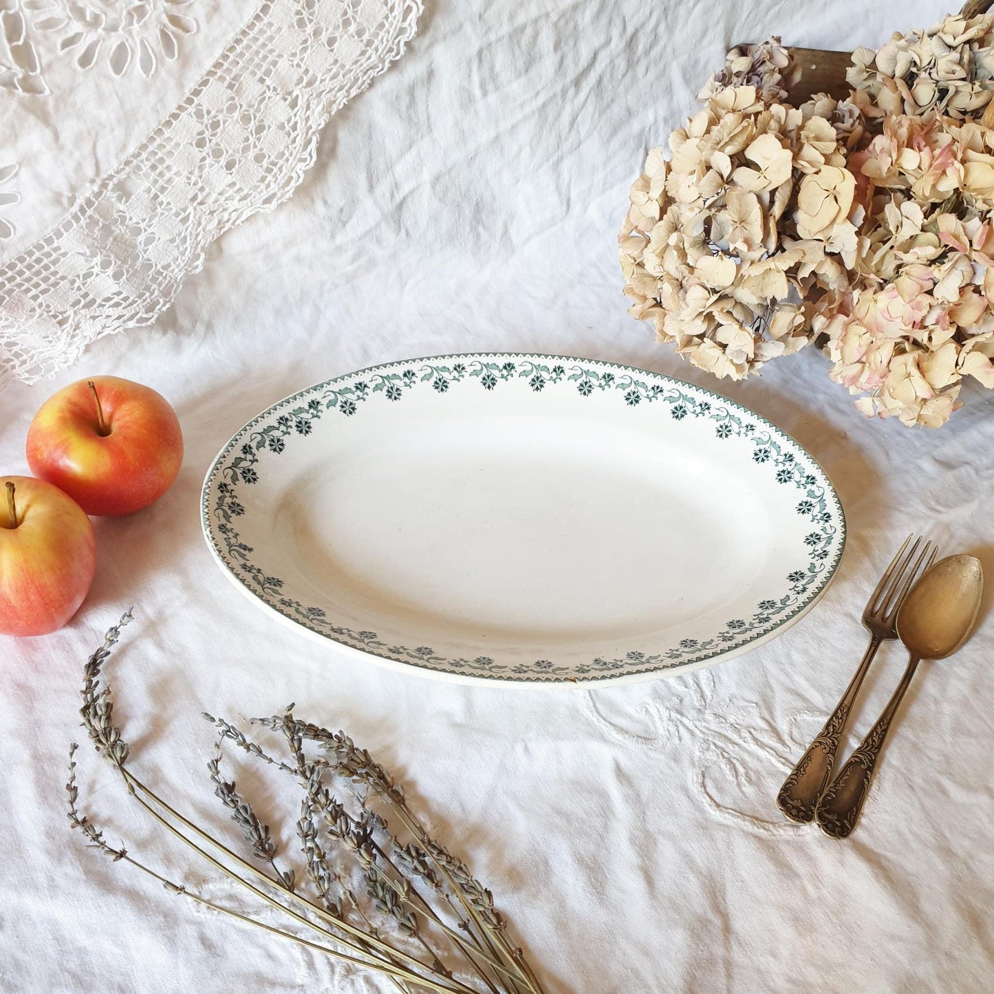 A Victorian-style oval serving dish with green transferware decoration on a white ground 'Georgette' pattern by Moulin des Loups, France 1900