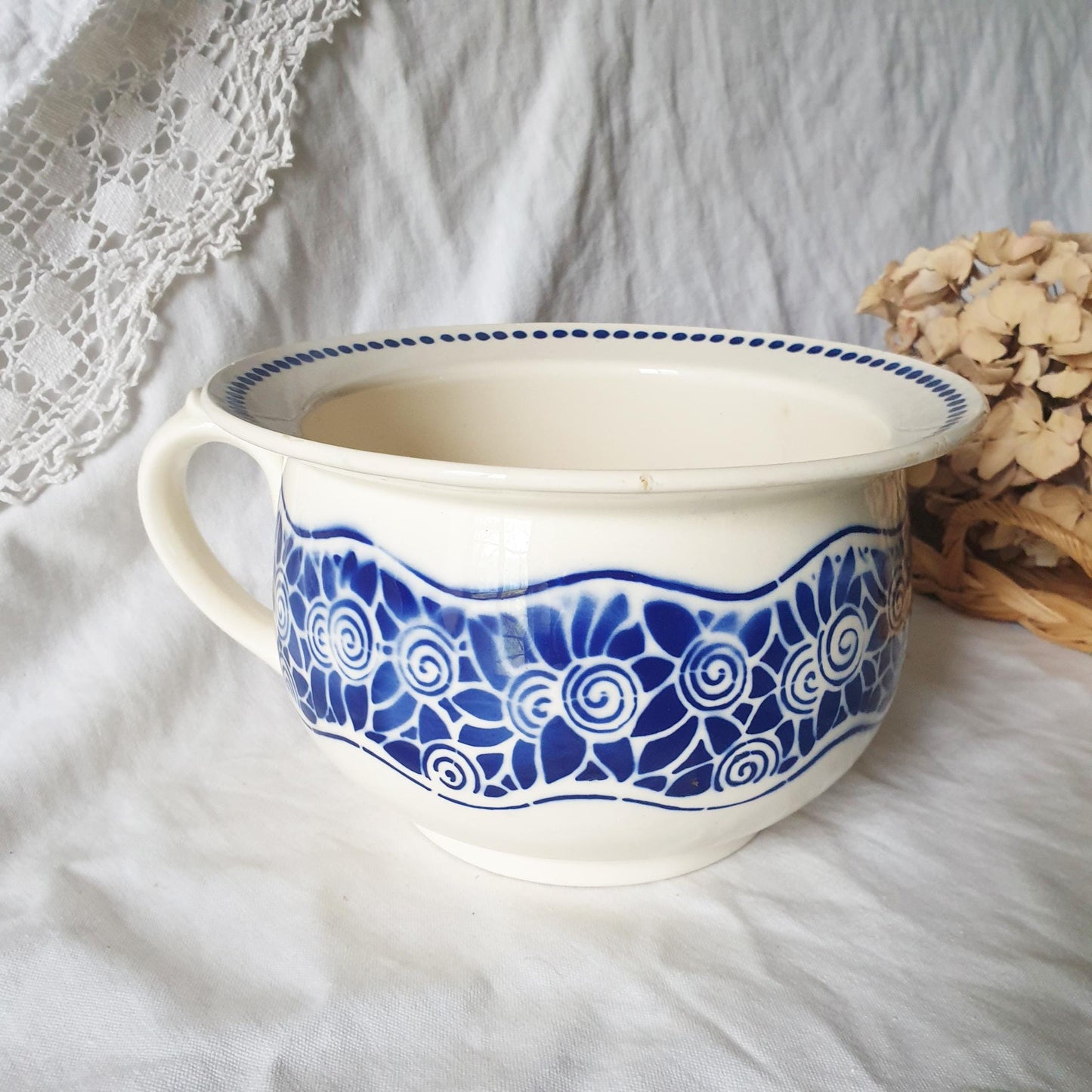 Vintage French Antique Art Deco style chamber pot from Badonviller, France. Planter blue stencil painted decoration 1910-1920s Ceramic Chamber Pot. White model with blue stylized flower motifs, on white earthenware.