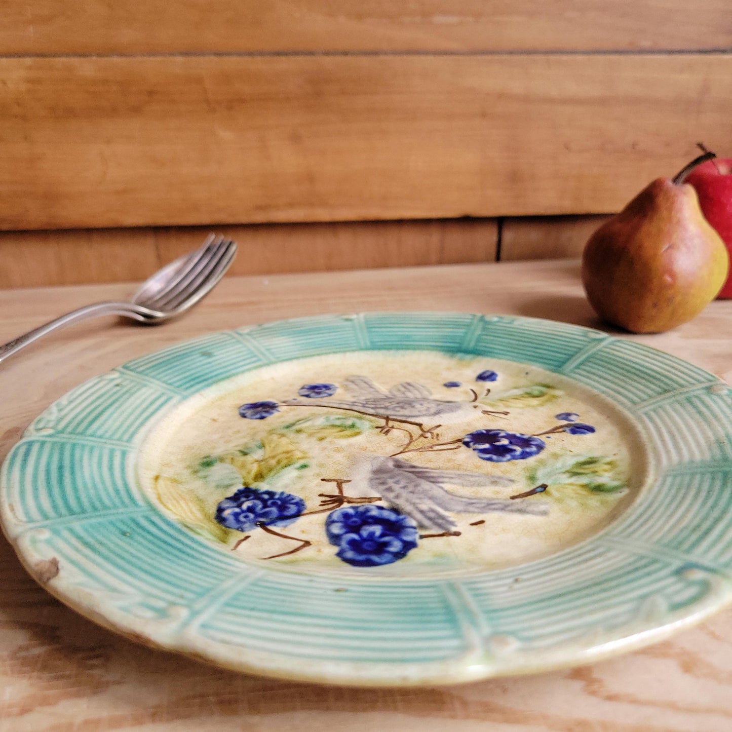 French antique barbotine majolica plate, songbirds on flower branch design, polychrome on cream-yellow ground, ridged border, France c1890