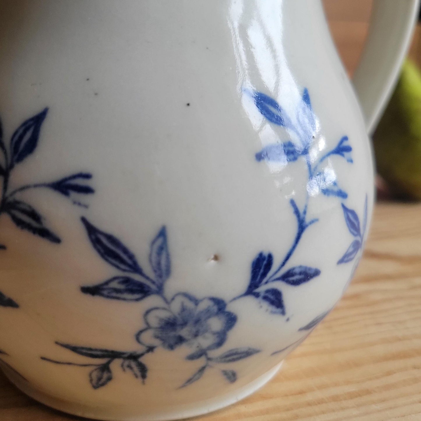 Antique stoneware milk jug with offset handle blue and white florals and leaves St Uze France c 1900
