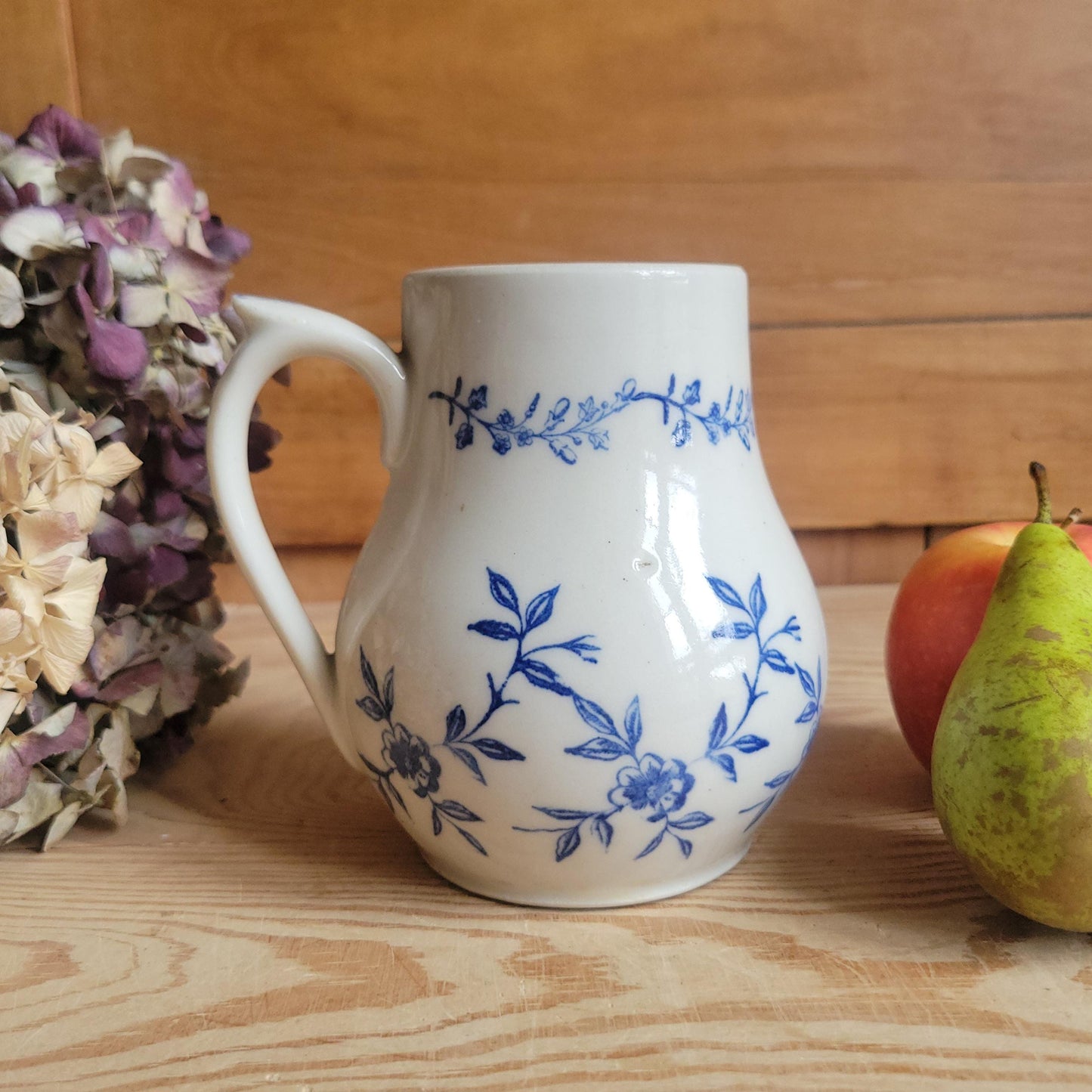 Antique stoneware milk jug with offset handle blue and white florals and leaves St Uze France c 1900
