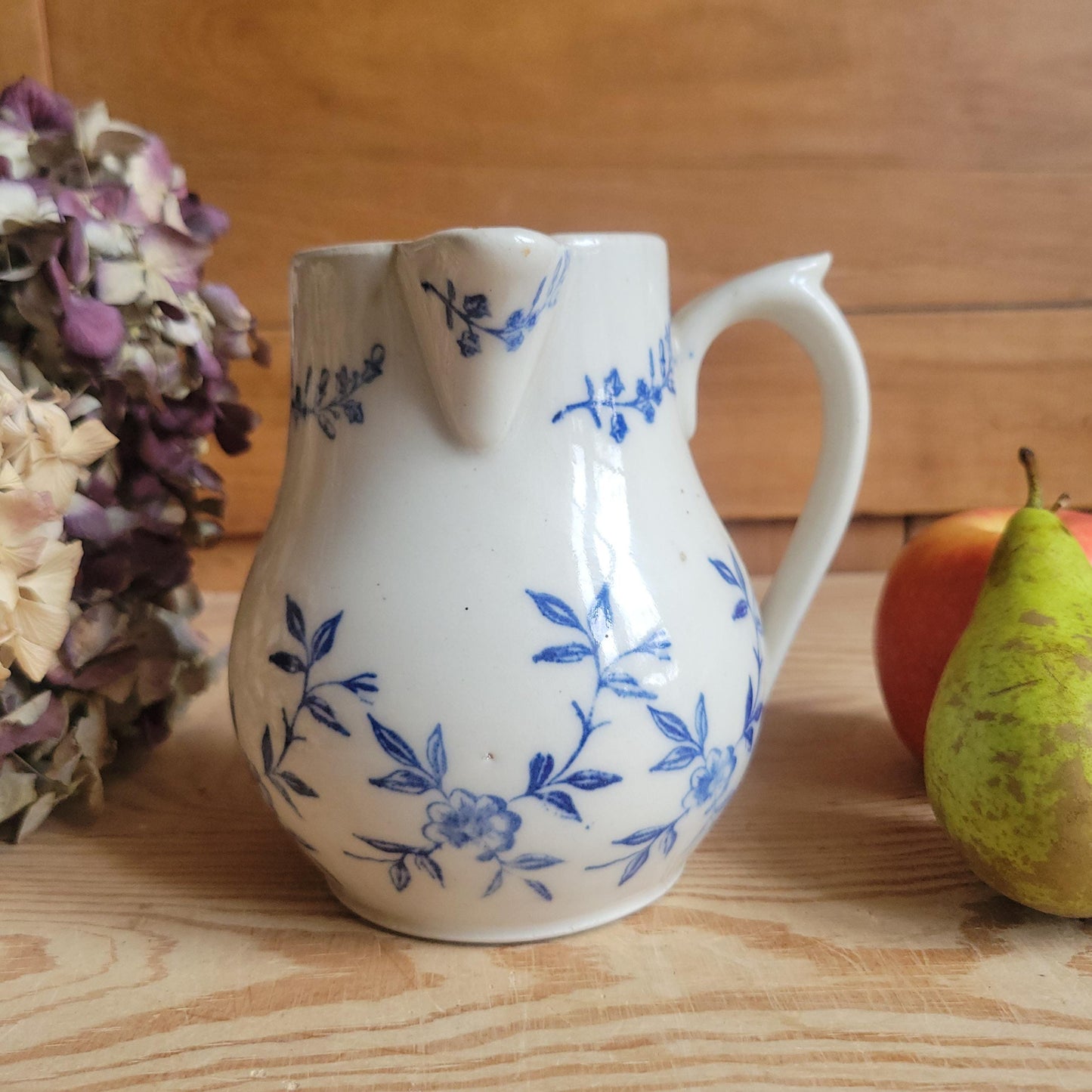 Antique stoneware milk jug with offset handle blue and white florals and leaves St Uze France c 1900