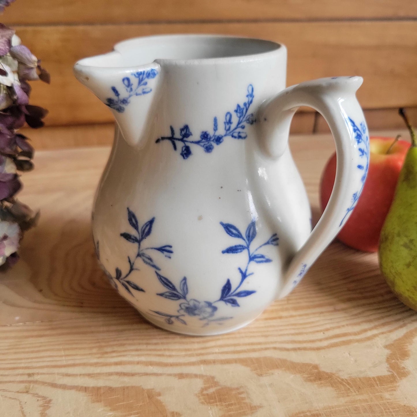 Antique stoneware milk jug with offset handle blue and white florals and leaves St Uze France c 1900