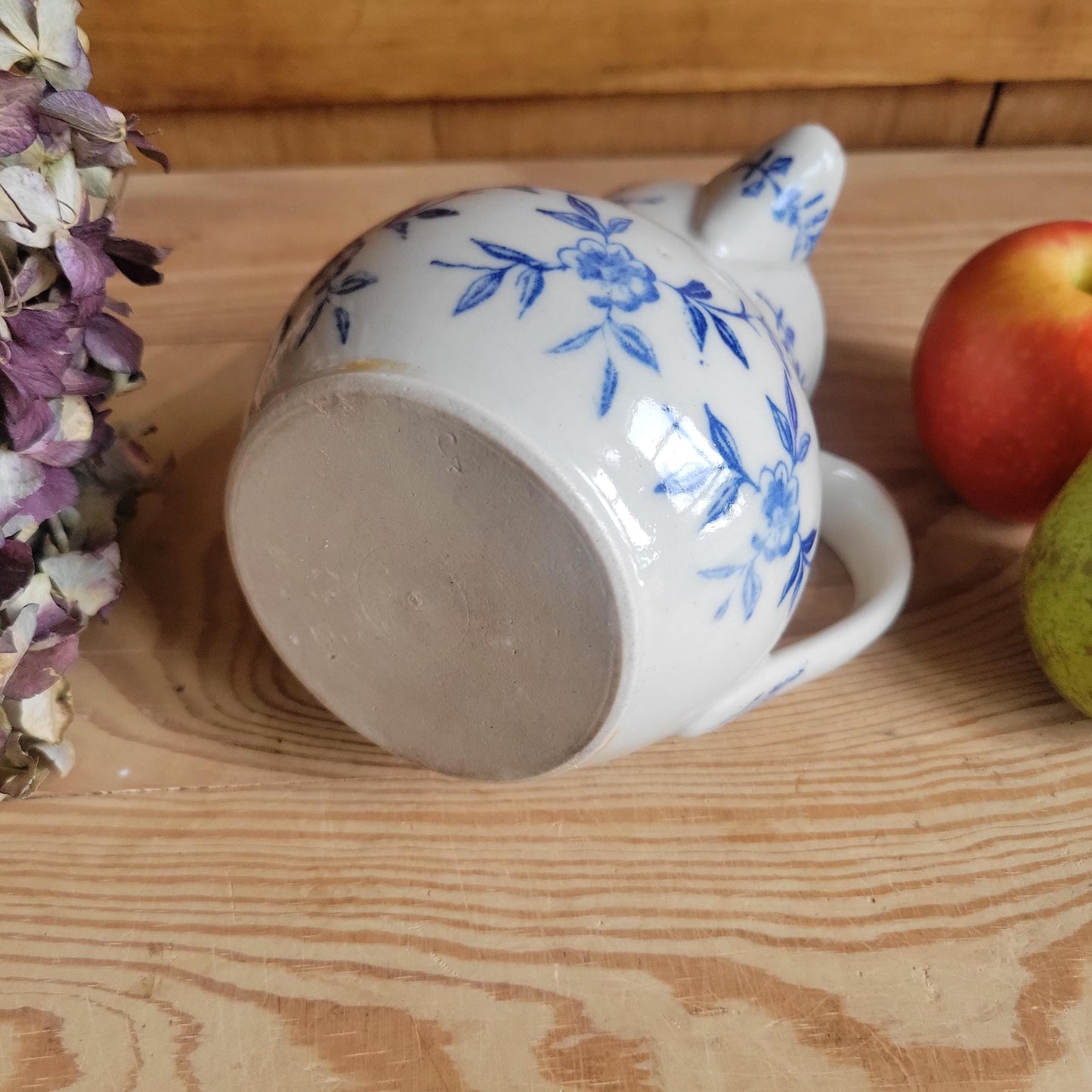 Antique stoneware milk jug with offset handle blue and white florals and leaves St Uze France c 1900