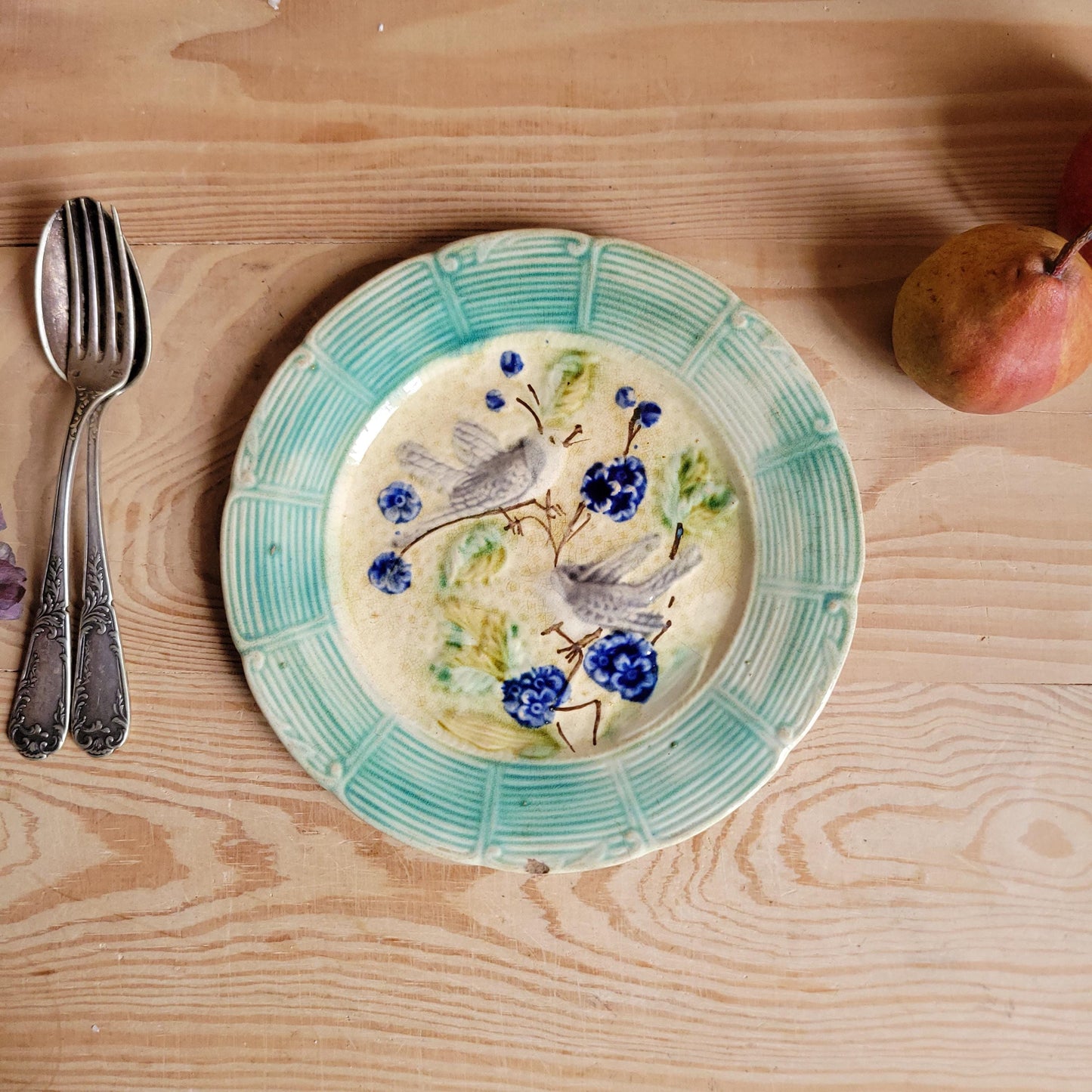 French antique barbotine majolica plate, songbirds on flower branch design, polychrome on cream-yellow ground, ridged border, France c1890