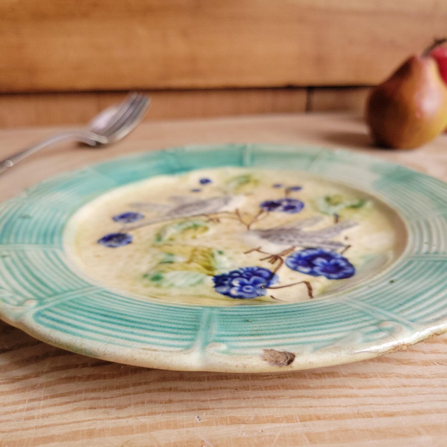 French antique barbotine majolica plate, songbirds on flower branch design, polychrome on cream-yellow ground, ridged border, France c1890