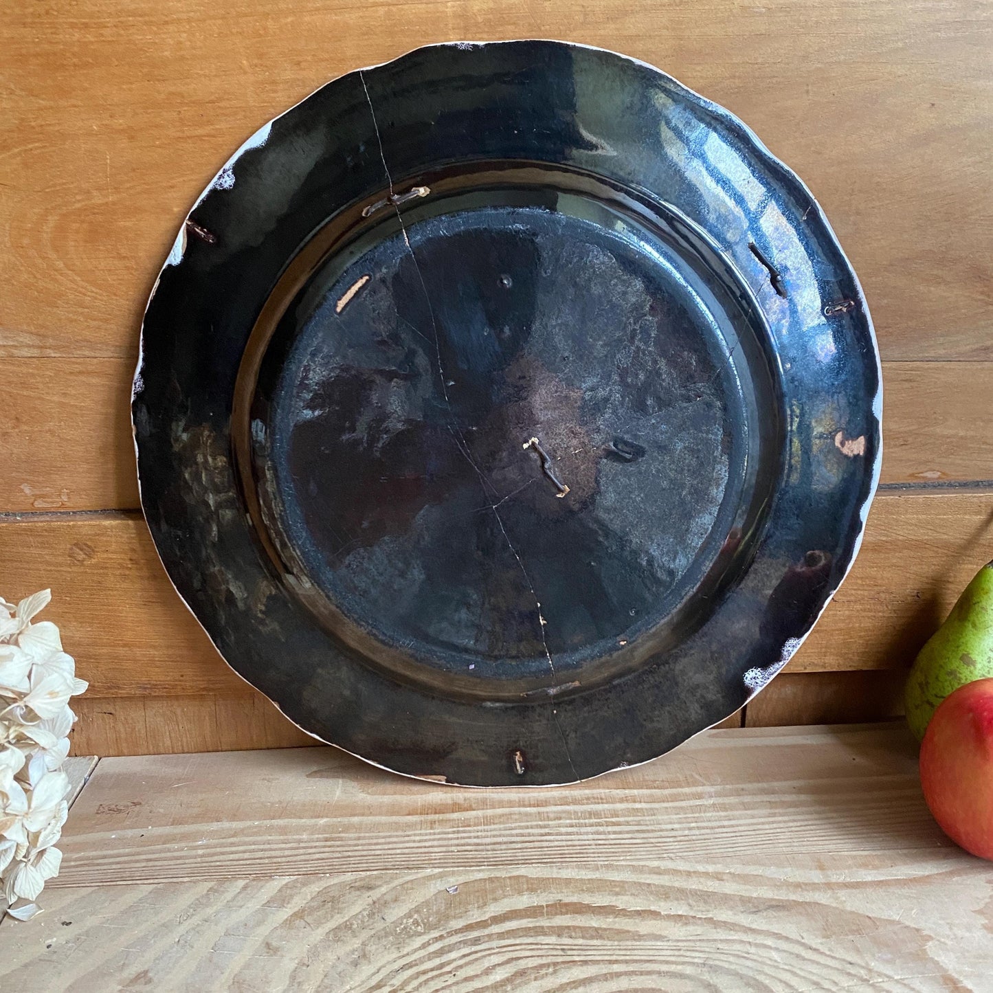 Antique round cul noir platter basket of flowers design with staple repairs. Rouen France c1880