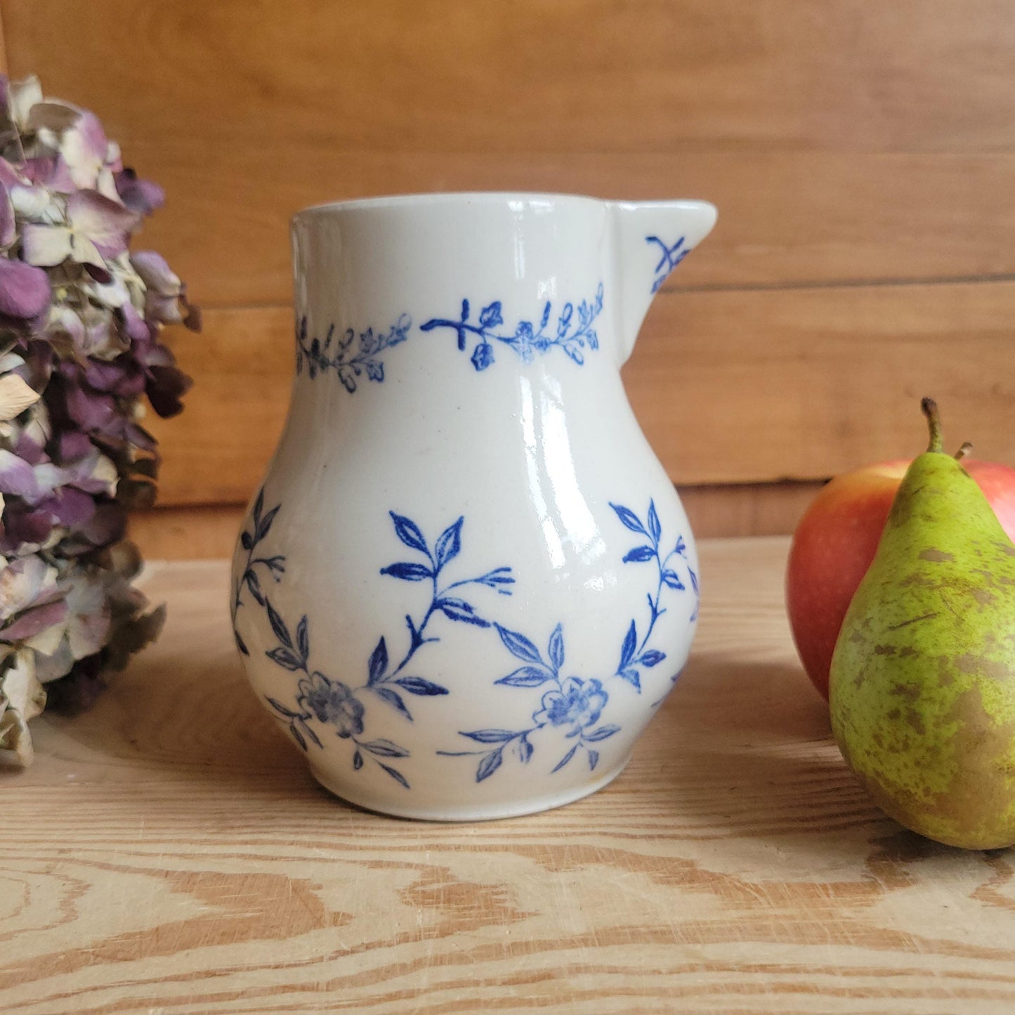 Antique stoneware milk jug with offset handle blue and white florals and leaves St Uze France c 1900